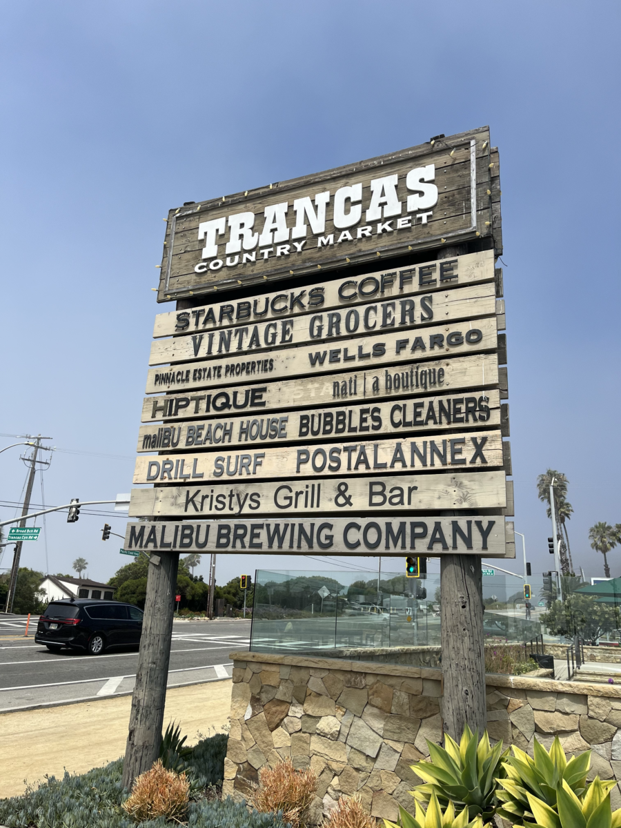 Trancas Country Market sign with list of stores and restaurants