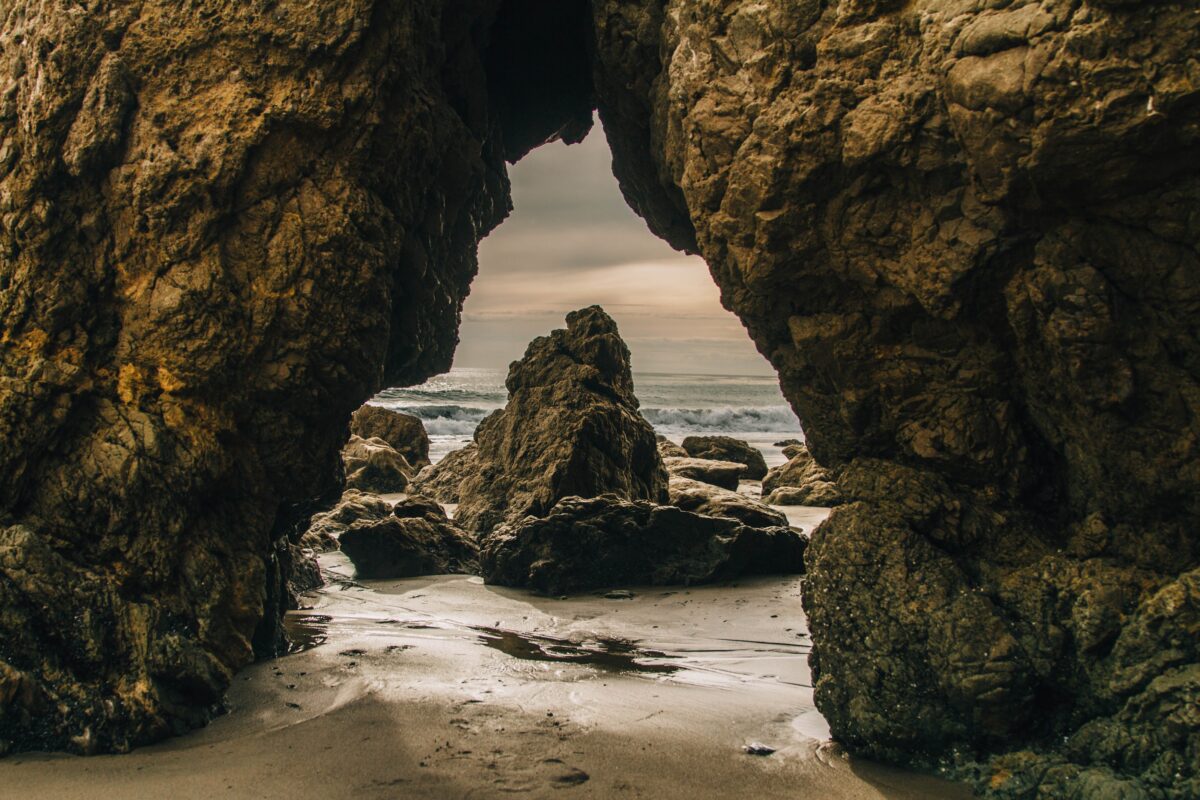 El Matador Beach sea cave - view of rock and ocean through cave/arch.