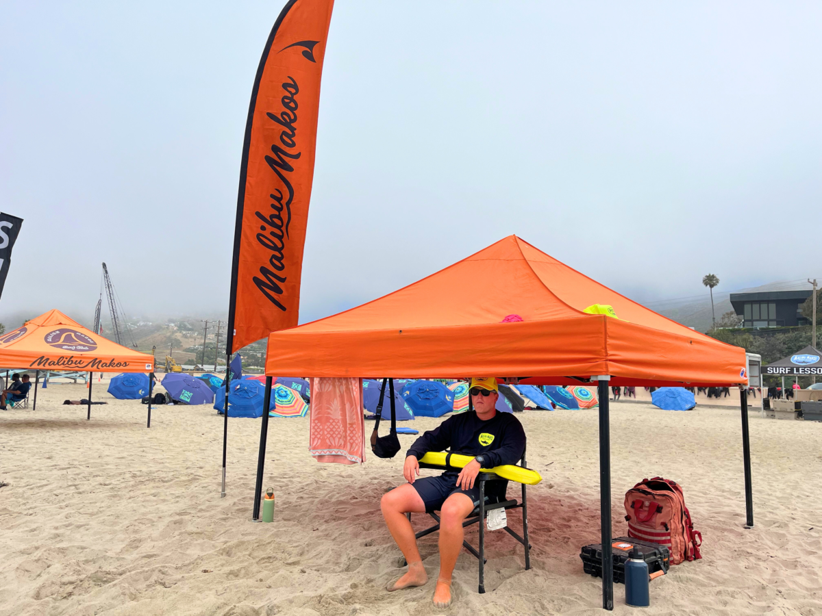 Makos Malibu lifeguard looking out at the ocean keeping an eye on surfers.