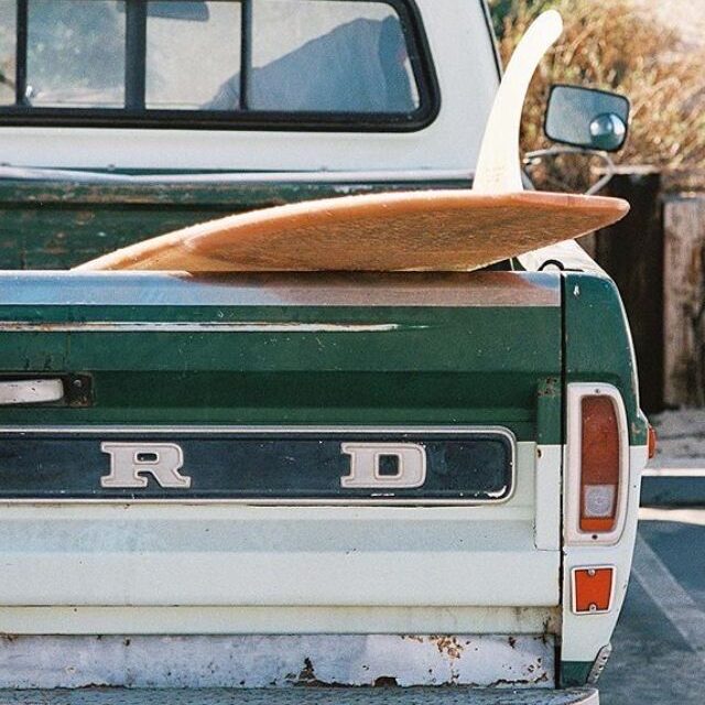 Malibu Boutique Shopping truck with surfboard.